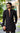 Black designer kurta worn by Shadan Farooqui featuring brown piping on cuffs and collar
